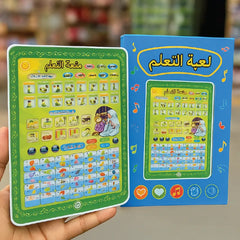 Educational Arabic Learning Tablet Toy with colorful design held by a hand, against a blurred background.