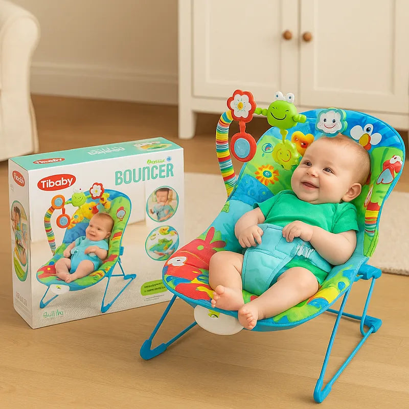 Baby in a colorful bouncer with a matching toy and packaging on a wooden floor.