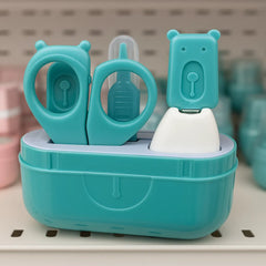 Teal nail care set with scissors and files in a container on a white surface.