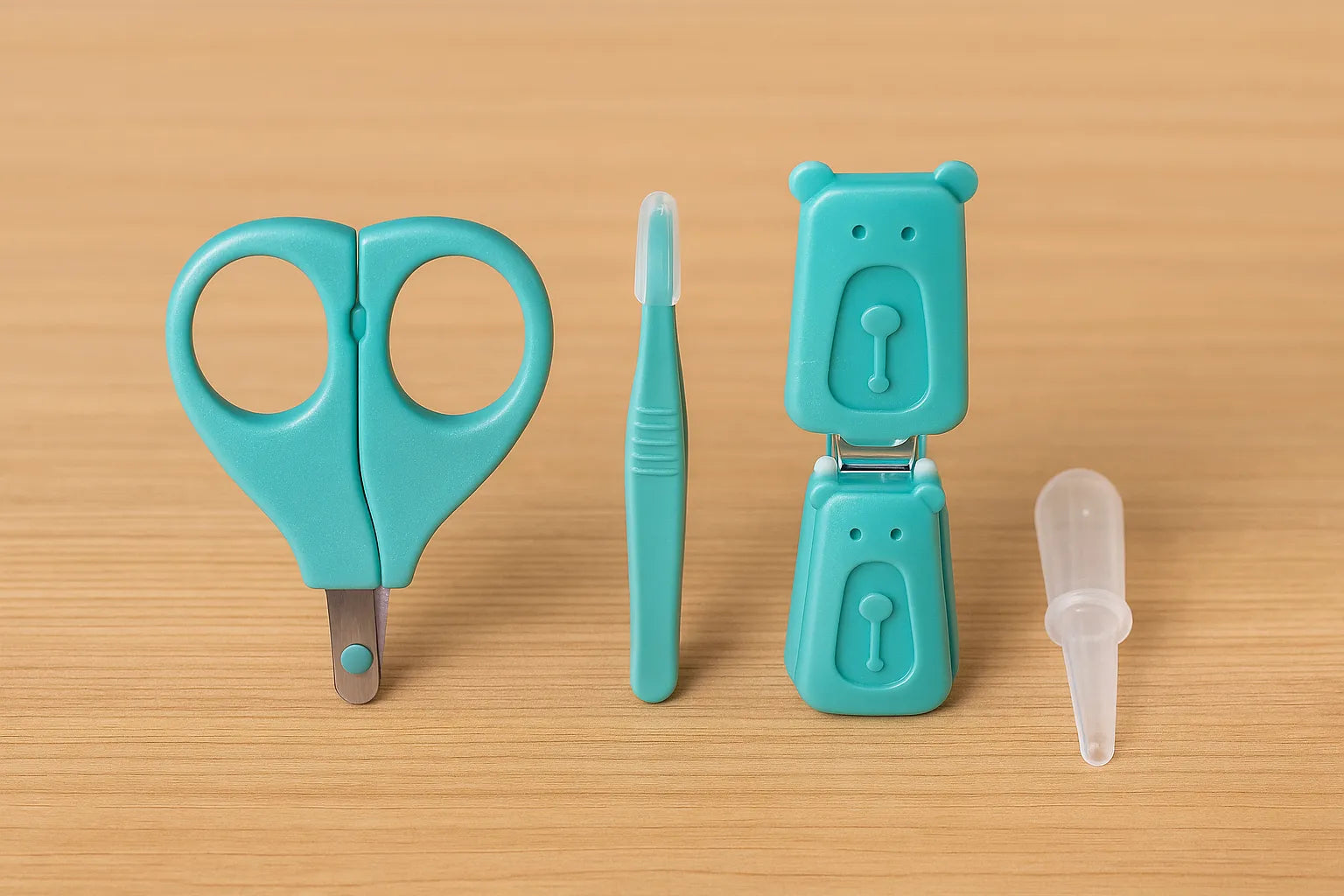 Set of teal baby care tools including scissors, toothbrush, and container on a beige background