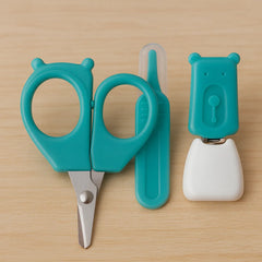 Turquoise children's scissors with a matching clip 